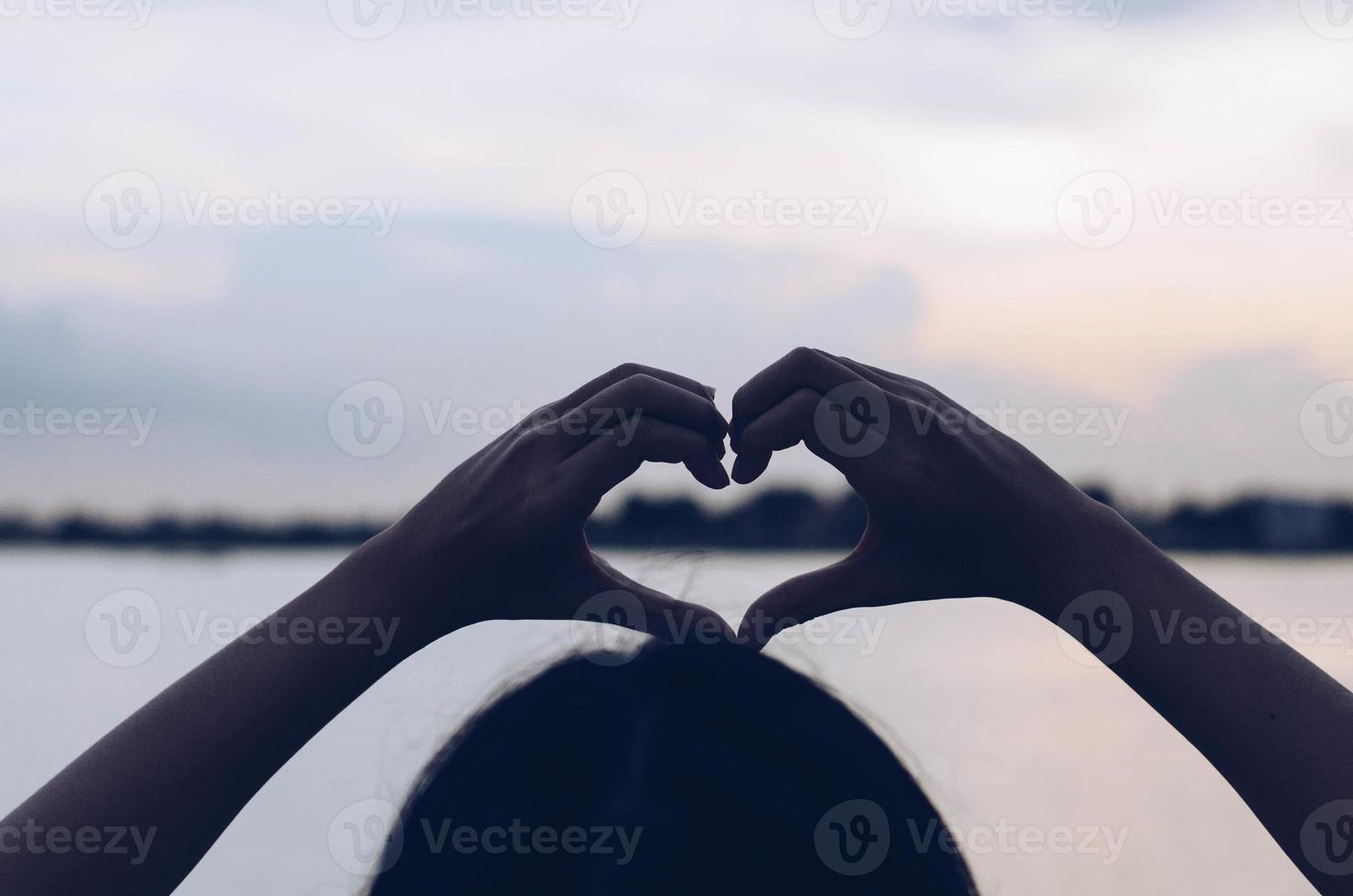 hands in the form of heart photo