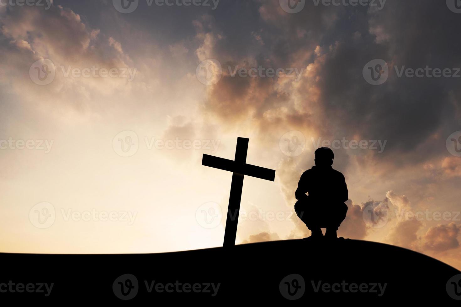 The cross and men on mountain sunset background photo