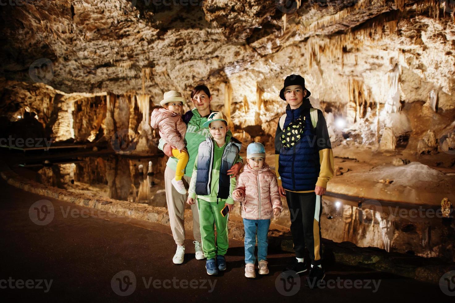 Family explores at Punkva Caves, Czech Republic. photo