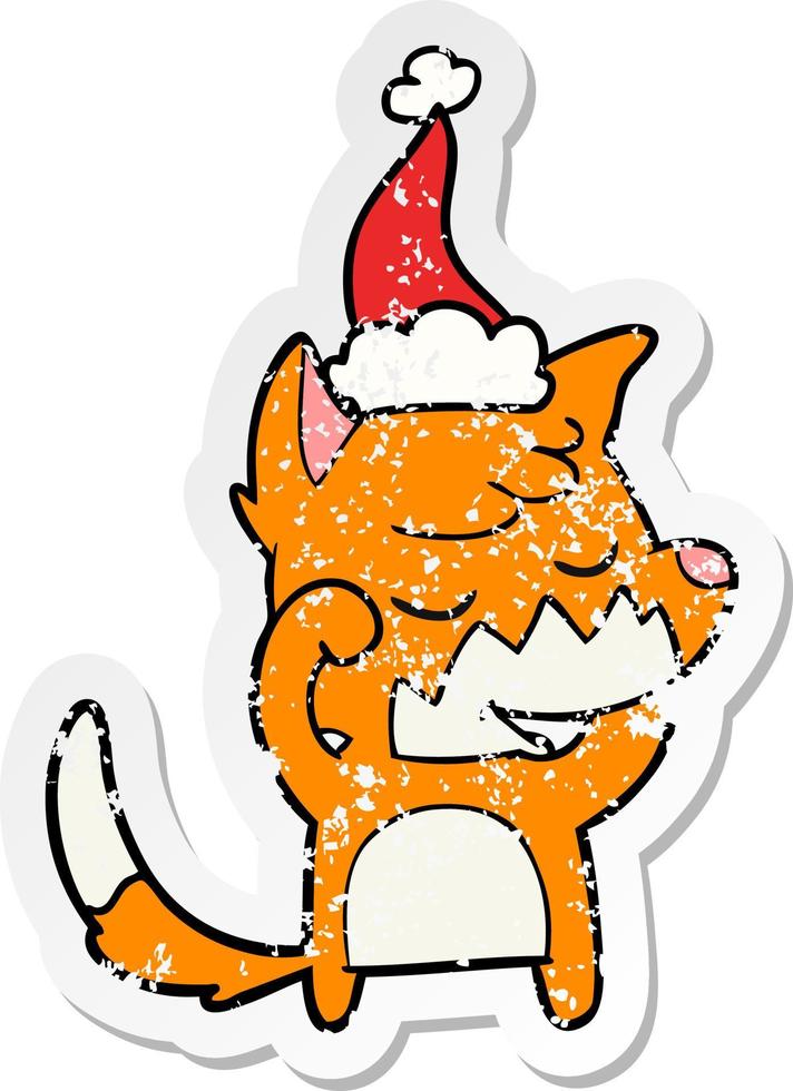 friendly distressed sticker cartoon of a fox waking up wearing santa hat vector