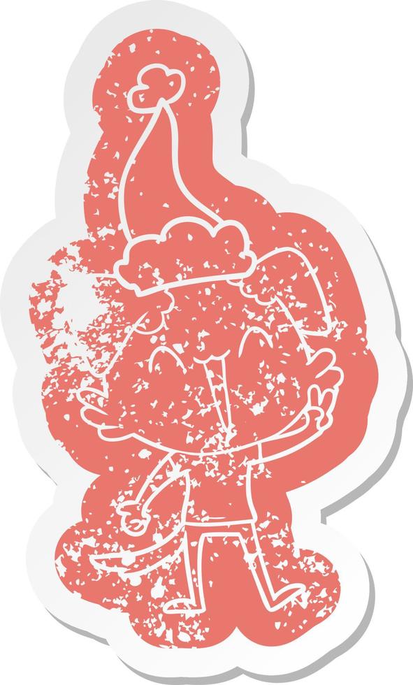 happy little dog cartoon distressed sticker of a wearing santa hat vector