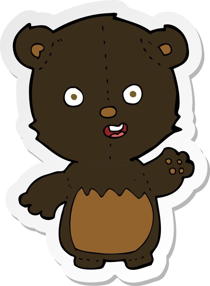 sticker of a cartoon waving black bear cub vector