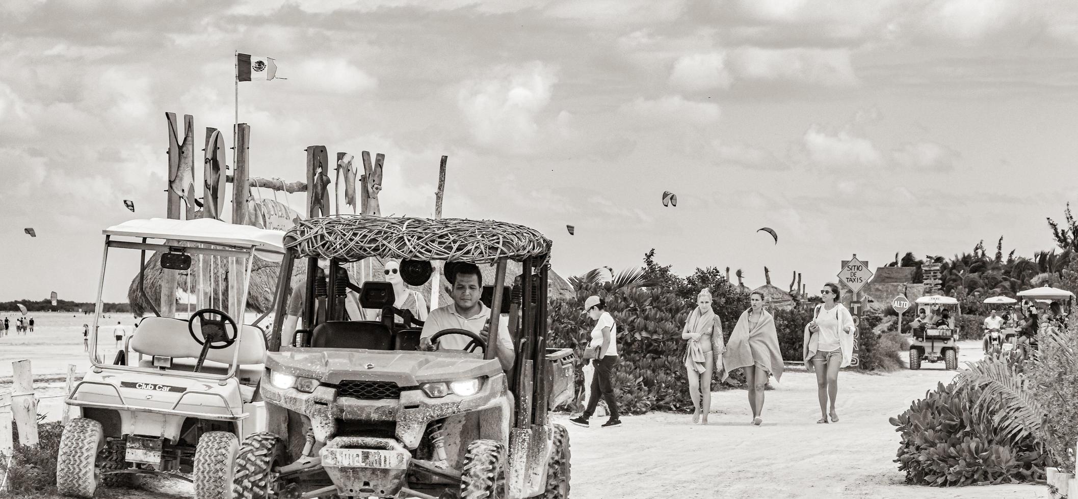 Holbox Quintana Roo Mexico 2021 Golf cart buggy cars carts muddy street beach Holbox Mexico. photo