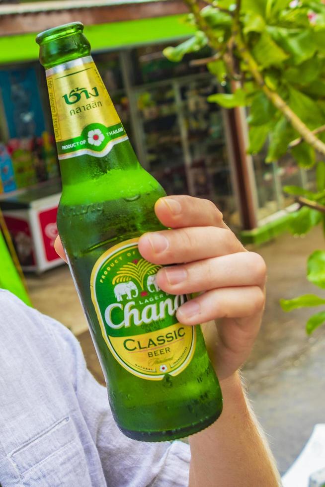 Nathon Beach Phuket Thailand 2018 Tourist holds Thai beer Chang Nai Thon Beach Phuket Thailand. photo