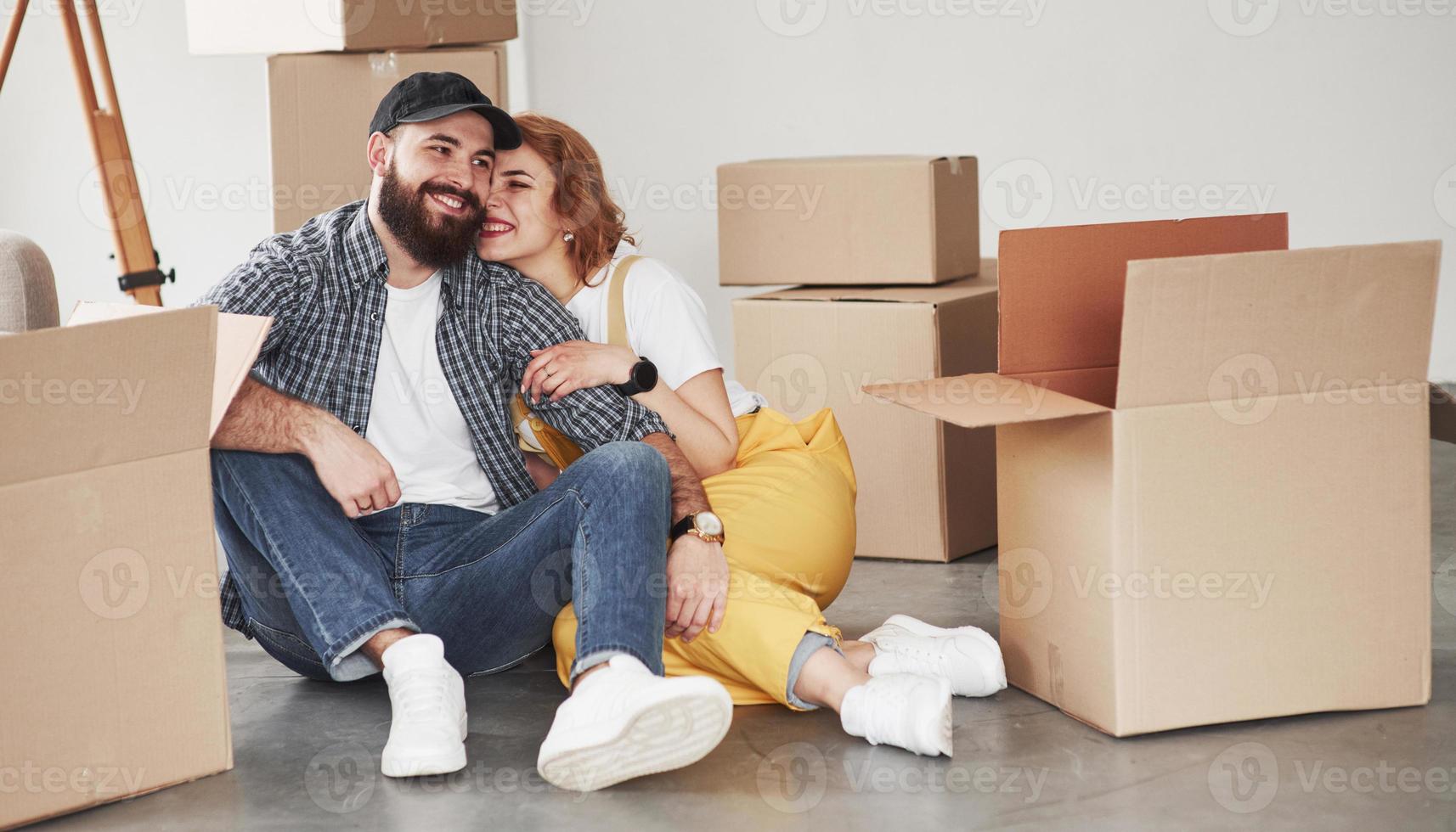 Enjoying beeing together. Happy couple together in their new house. Conception of moving photo