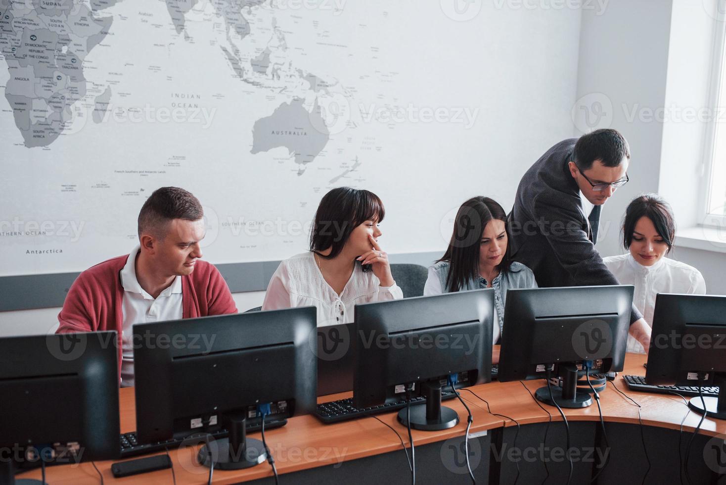 Training day. Business people and manager working on their new project in classroom photo
