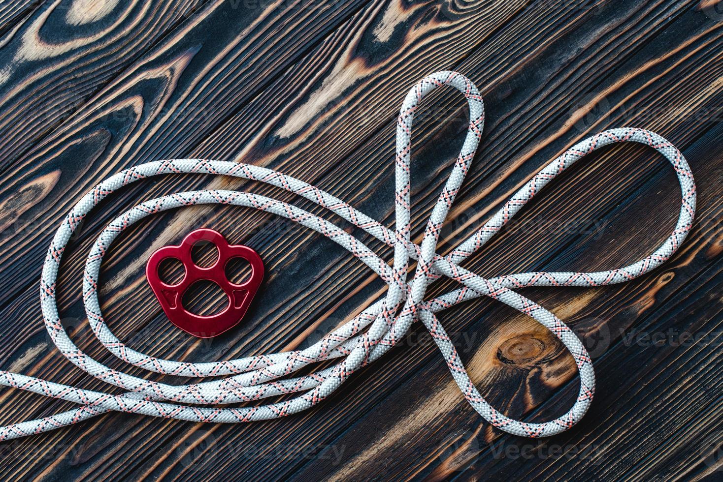 It's your safety in mountains. Isolated photo of climbing equipment. Parts of carabiners lying on the wooden table
