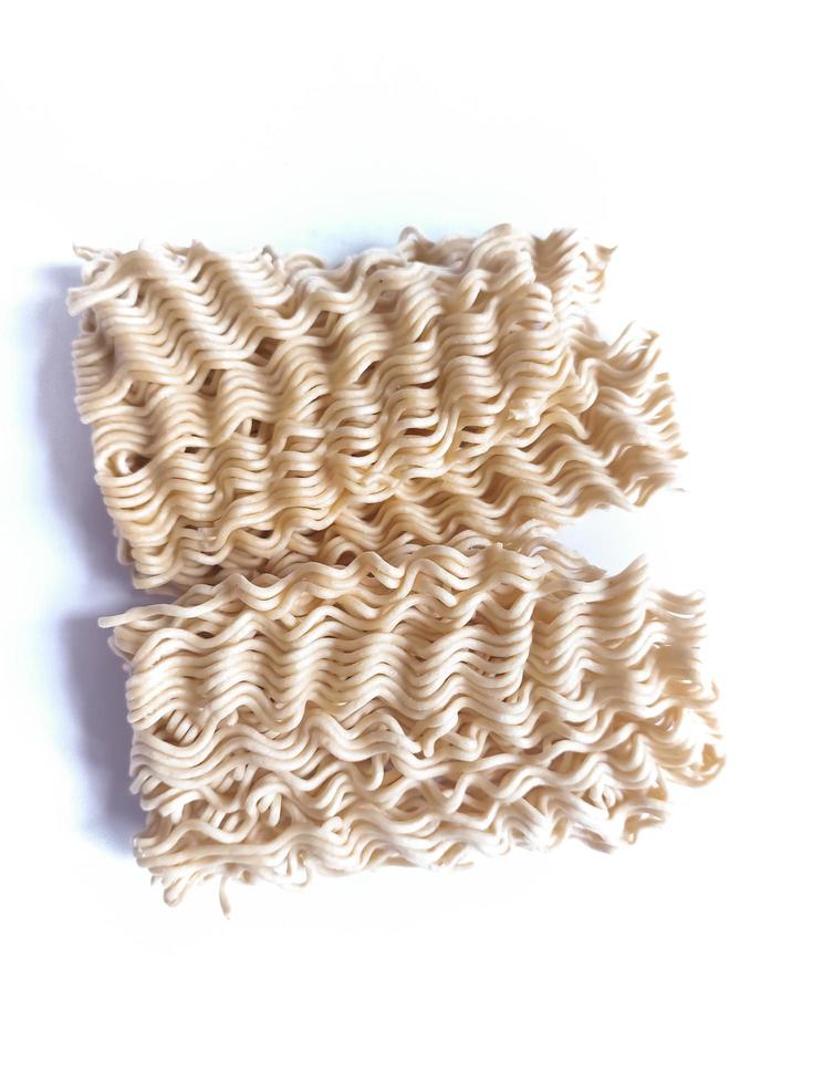 Uncooked instant noodles isolated on white background photo