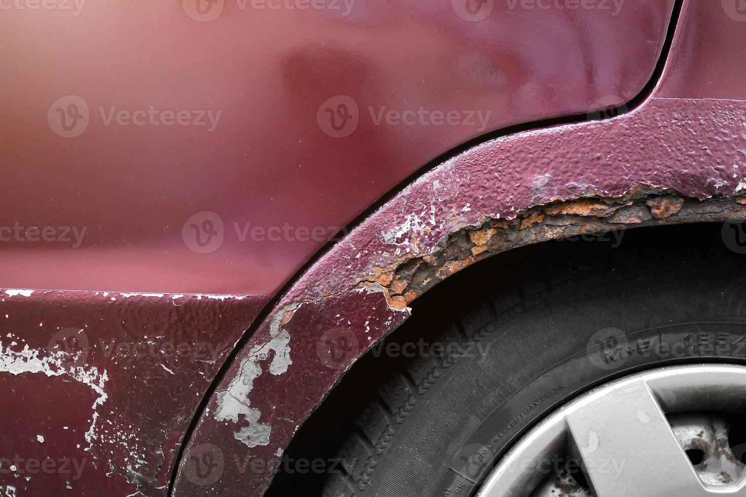 corrosion of the car body. Rusty wing close-up photo