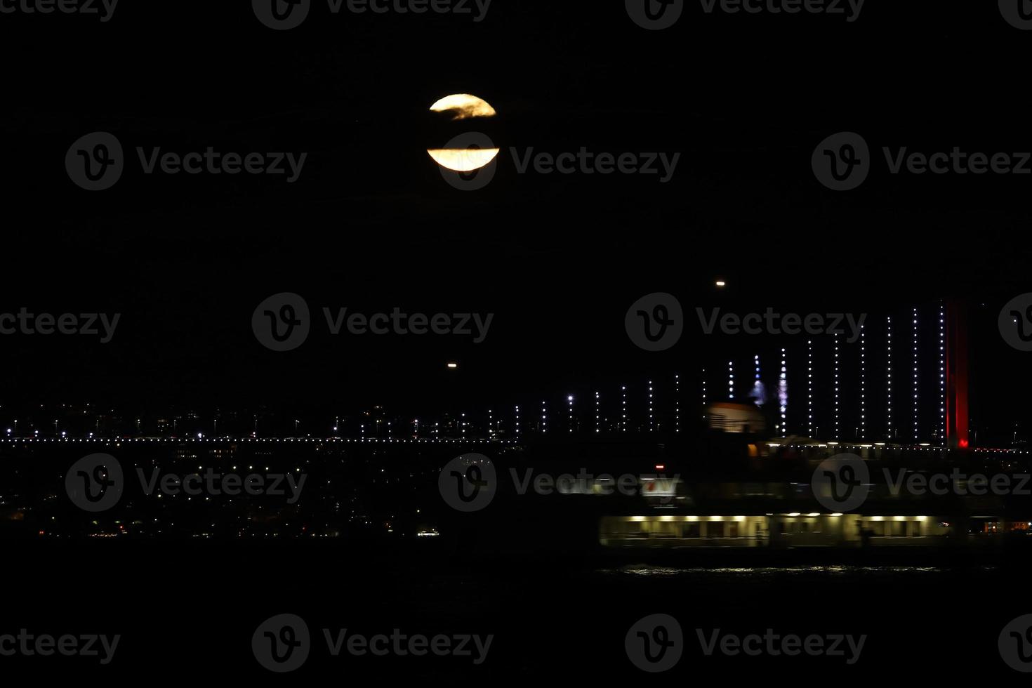 Full Moon rise over Bosphorus Bridge, Istanbul, Turkey photo