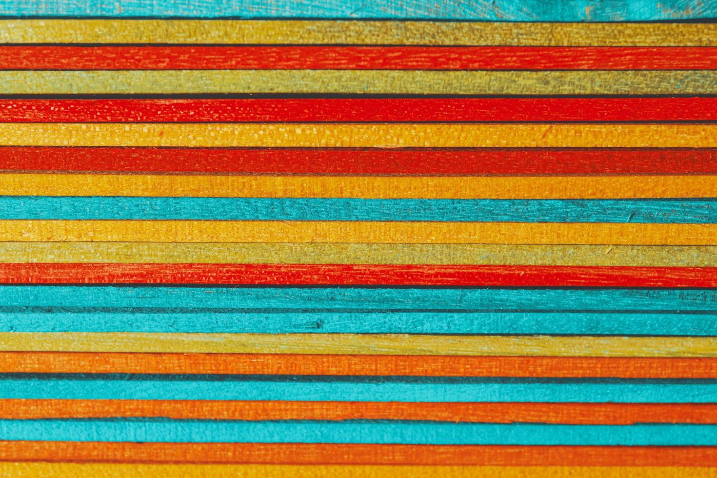 colored wooden sticks textured background photo