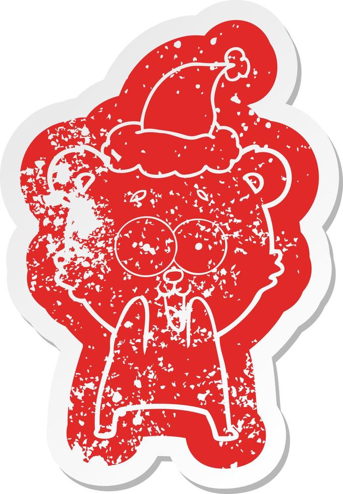 excited teddy bear cartoon distressed sticker of a wearing santa hat vector