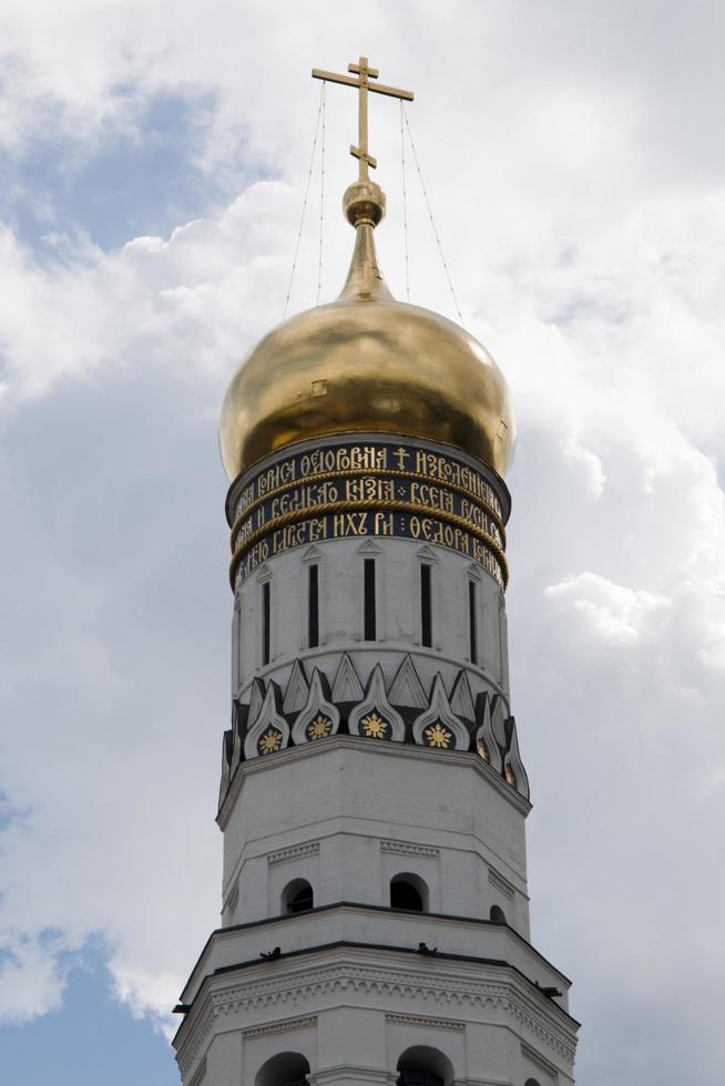 White and golden church tower inside the kremlin, Moscow photo