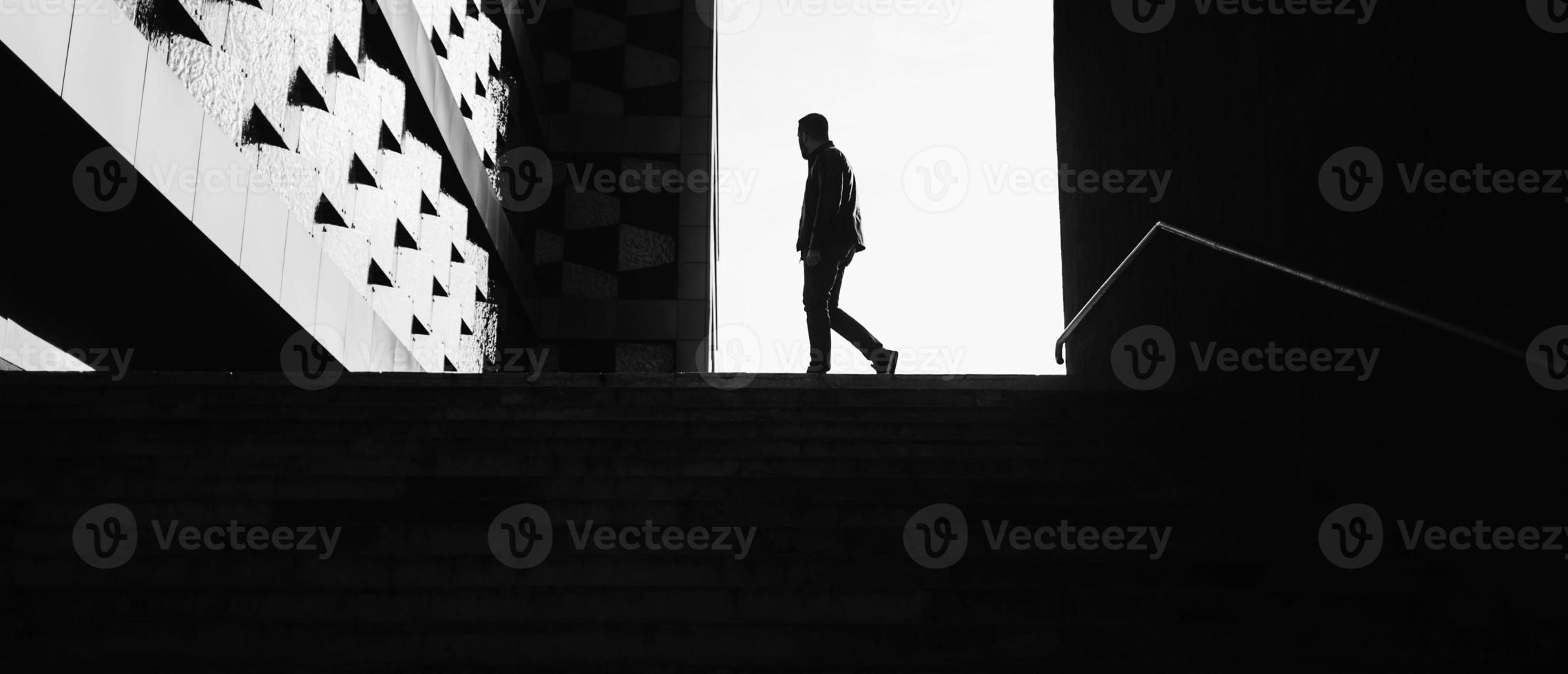 silhouette of a walking man photo