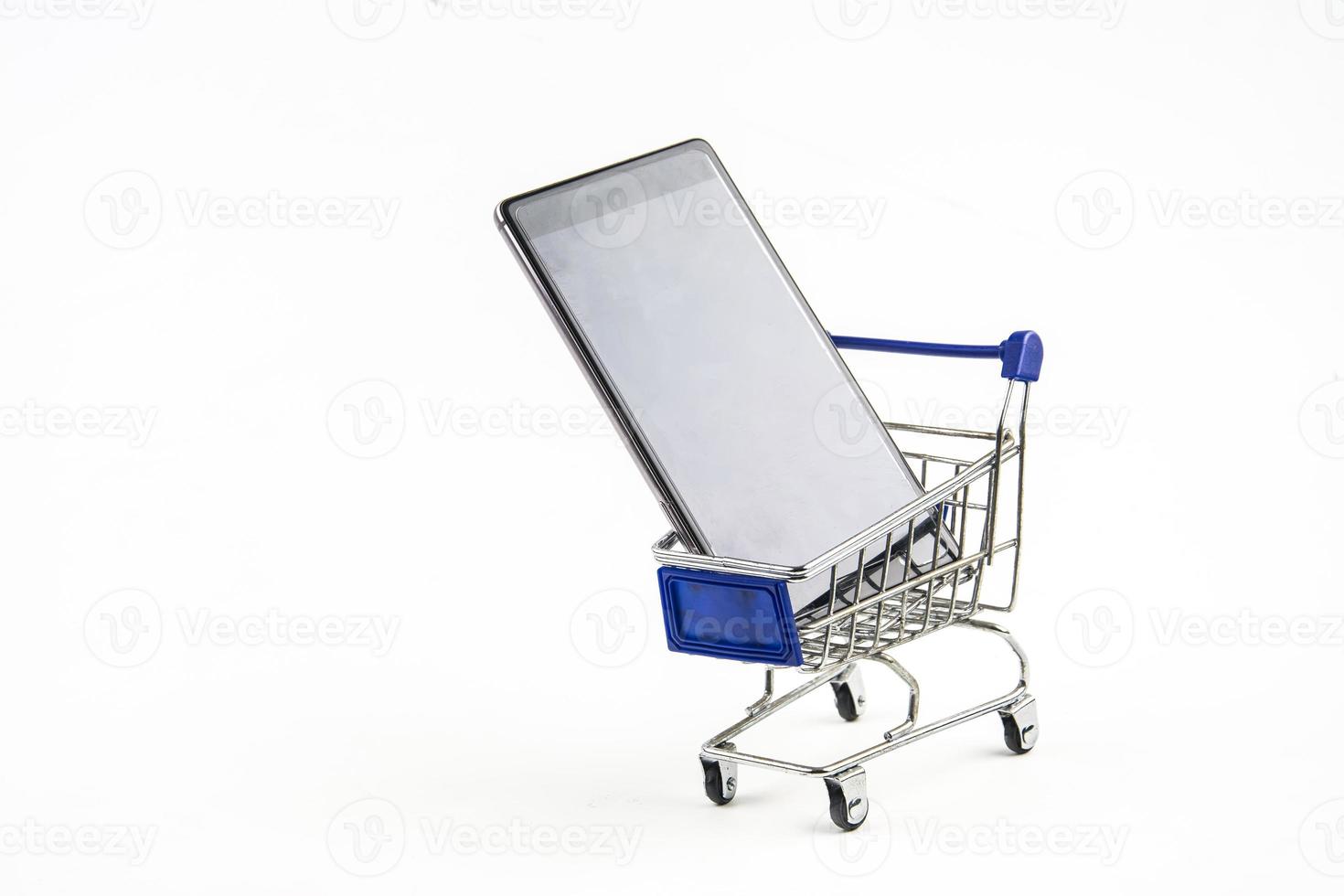smart phone with shopping cart on white background , Means shopping online photo