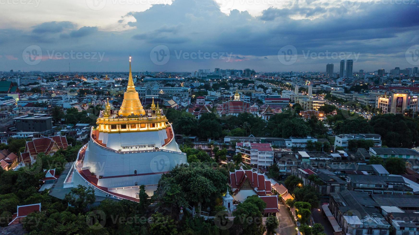 Golden Mountain  Wat Saket Ratcha Wora Maha Wihan popular Bangkok tourist attraction , Landmarks of bangkok Thailand . In the rain before , topview photo