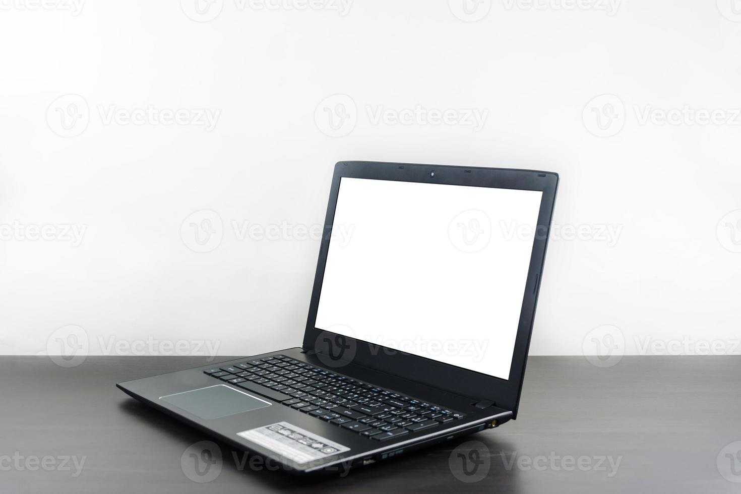 Computer notebook blank screen on wood table photo