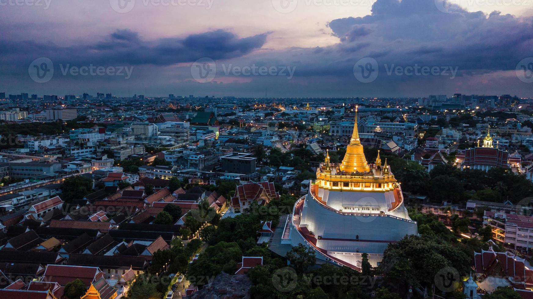 Golden Mountain  Wat Saket Ratcha Wora Maha Wihan popular Bangkok tourist attraction , Landmarks of bangkok Thailand . In the rain before , topview photo
