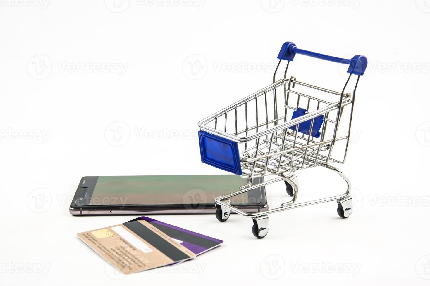 smart phone with shopping cart on white background , Means shopping online photo