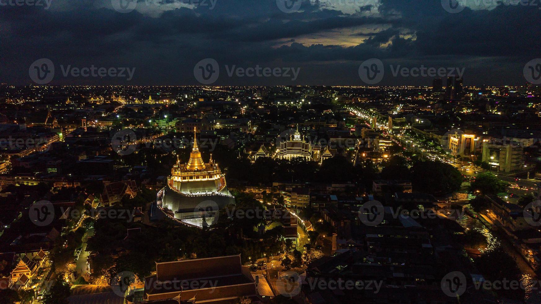 Golden Mountain  Wat Saket Ratcha Wora Maha Wihan popular Bangkok tourist attraction , Landmarks of bangkok Thailand . In the rain before , topview photo