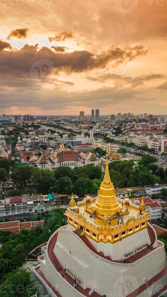 Golden Mountain  Wat Saket Ratcha Wora Maha Wihan popular Bangkok tourist attraction , Landmarks of bangkok Thailand . In the rain before , topview photo