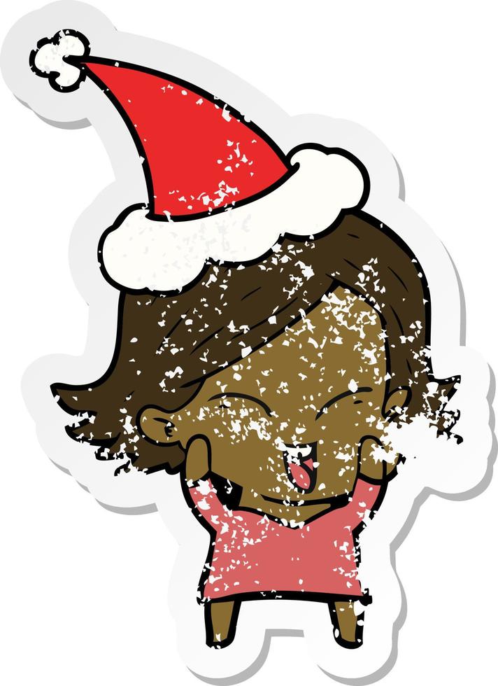 happy distressed sticker cartoon of a girl wearing santa hat vector