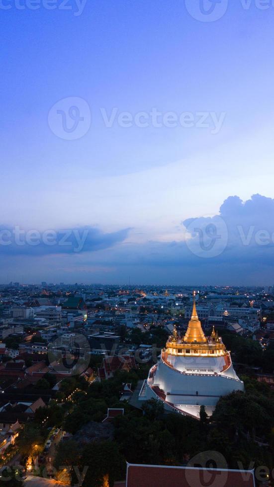 Golden Mountain  Wat Saket Ratcha Wora Maha Wihan popular Bangkok tourist attraction , Landmarks of bangkok Thailand . In the rain before , topview photo