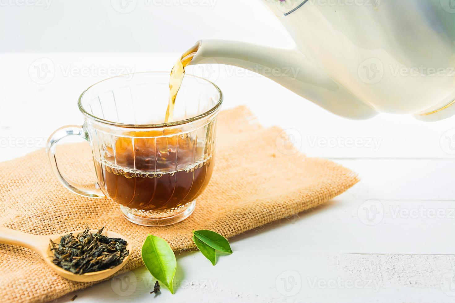 tea with  Tea glass on white wood photo