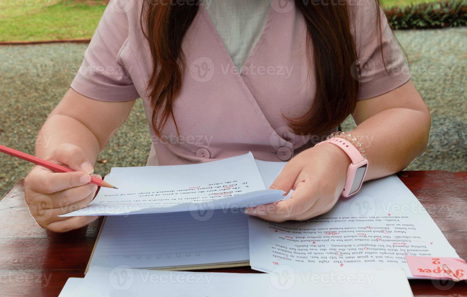 woman working on paperwork on table photo