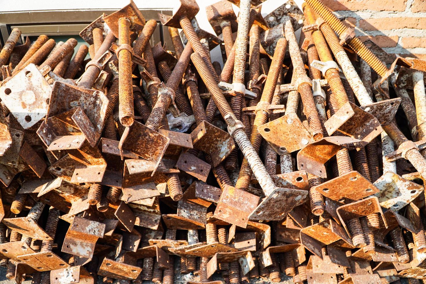 Props steel for scaffolding structure work. Rustic steels background. Preparing props equipment for industry construction.Rusty tubular props in construction site. photo