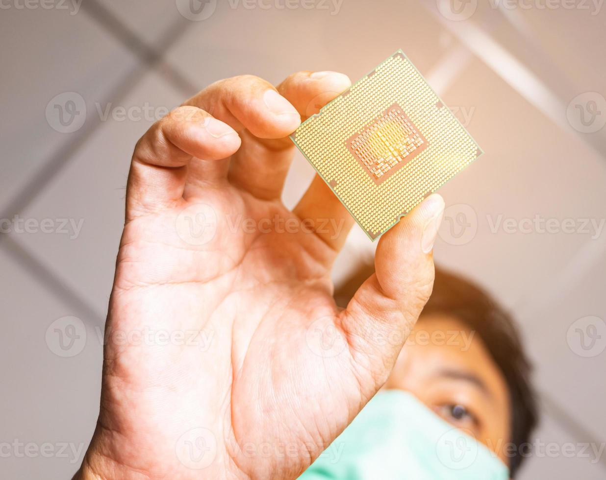 Take a picture of the angle of the cpu insertion. There is a picture of a person wearing a mess. Blurred and clear that the cpu has orange light, like in a laboratory. photo