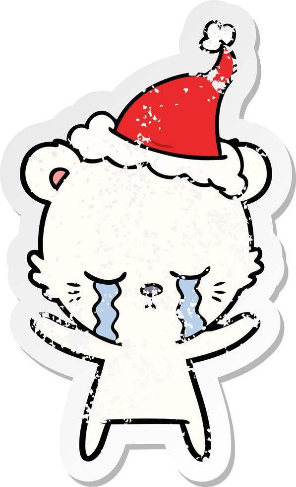 crying distressed sticker cartoon of a polarbear wearing santa hat vector