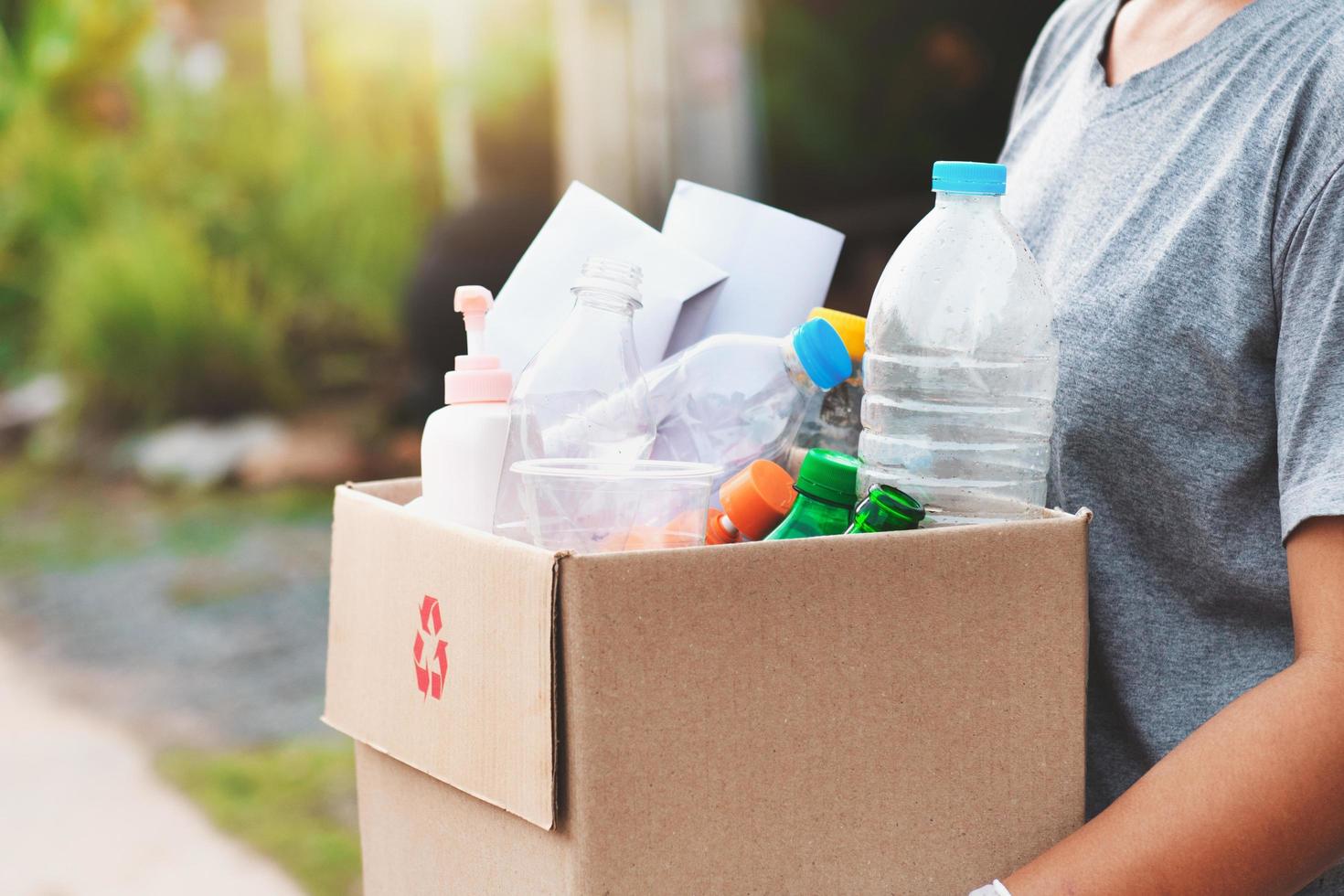 woman hand holdging box garbage for recycle photo