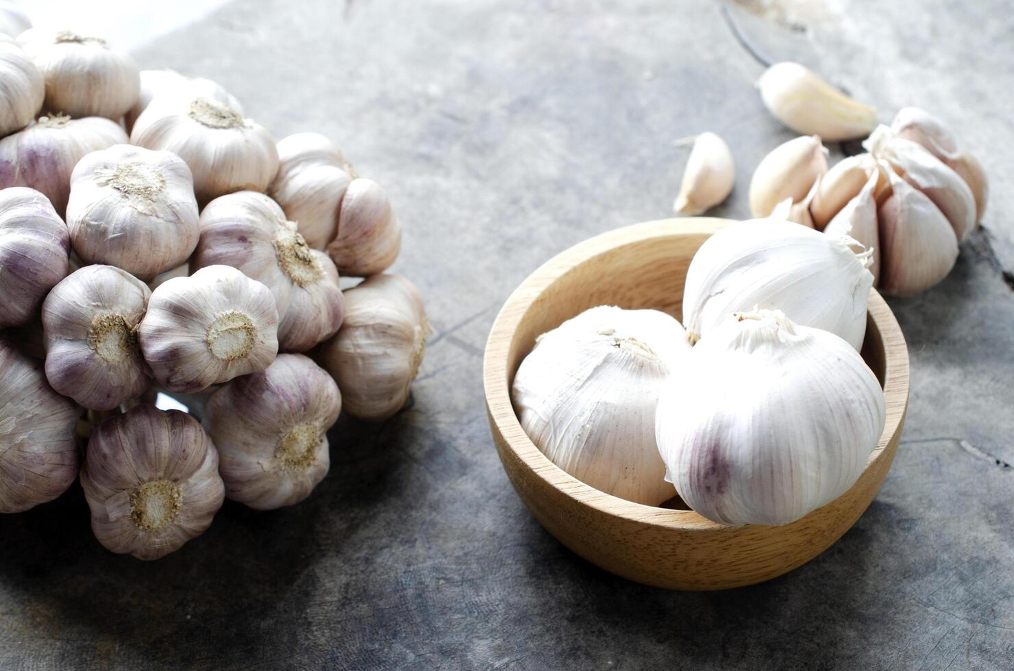 Close up of Garlic raw food on olds wood table backgrounds photo