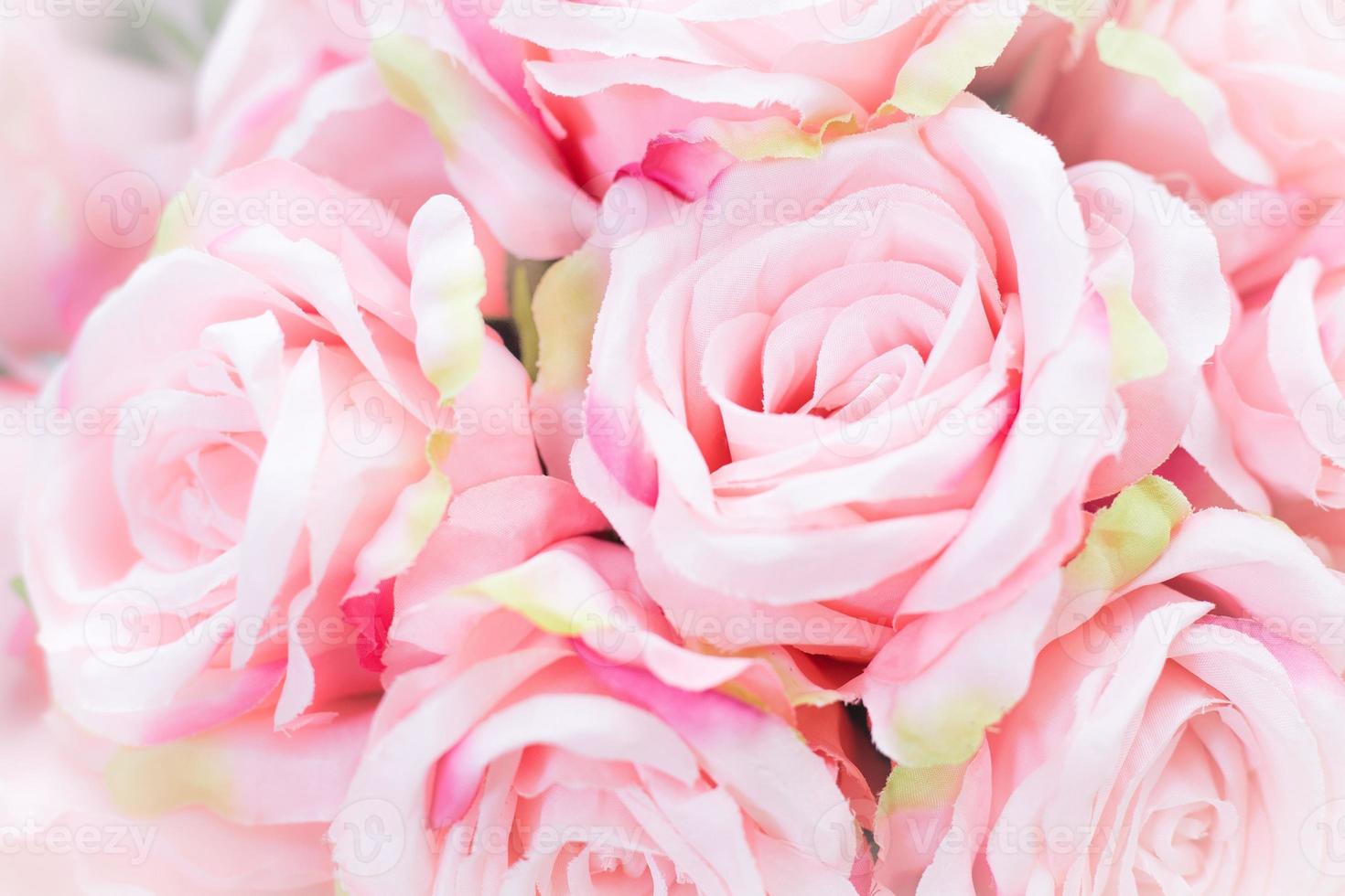 Close up of many fabric pale pink roses. photo