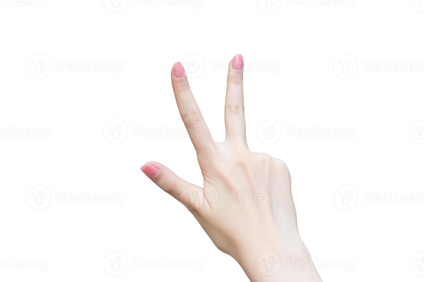 Woman's hand shows up three fingers as number three on white background. photo