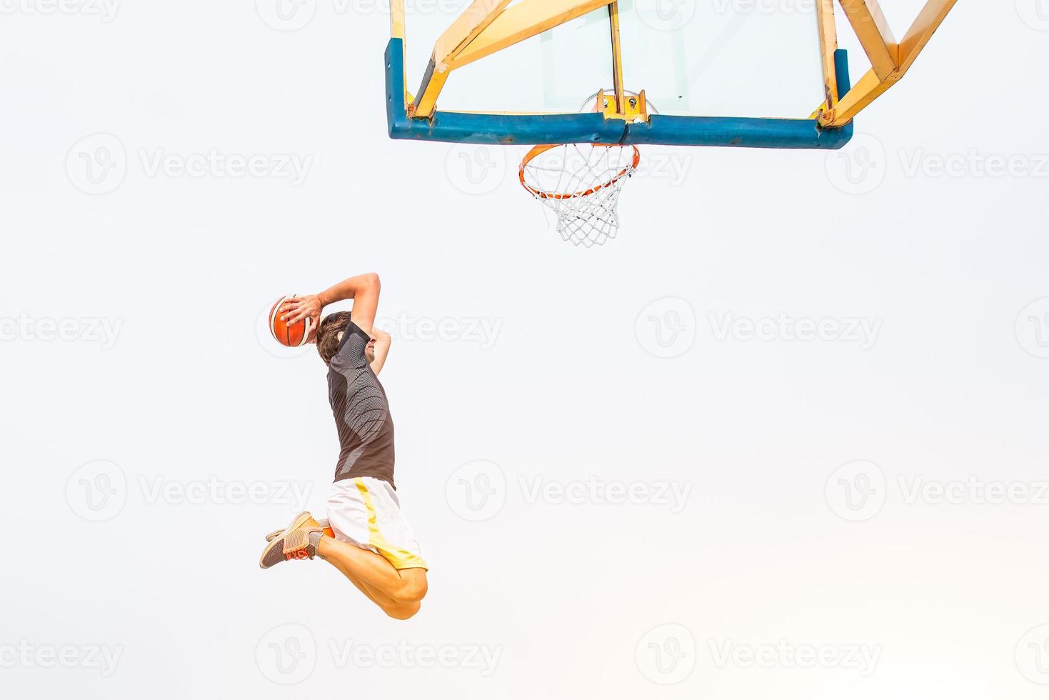 Performance of a white basketball player in the field of road photo