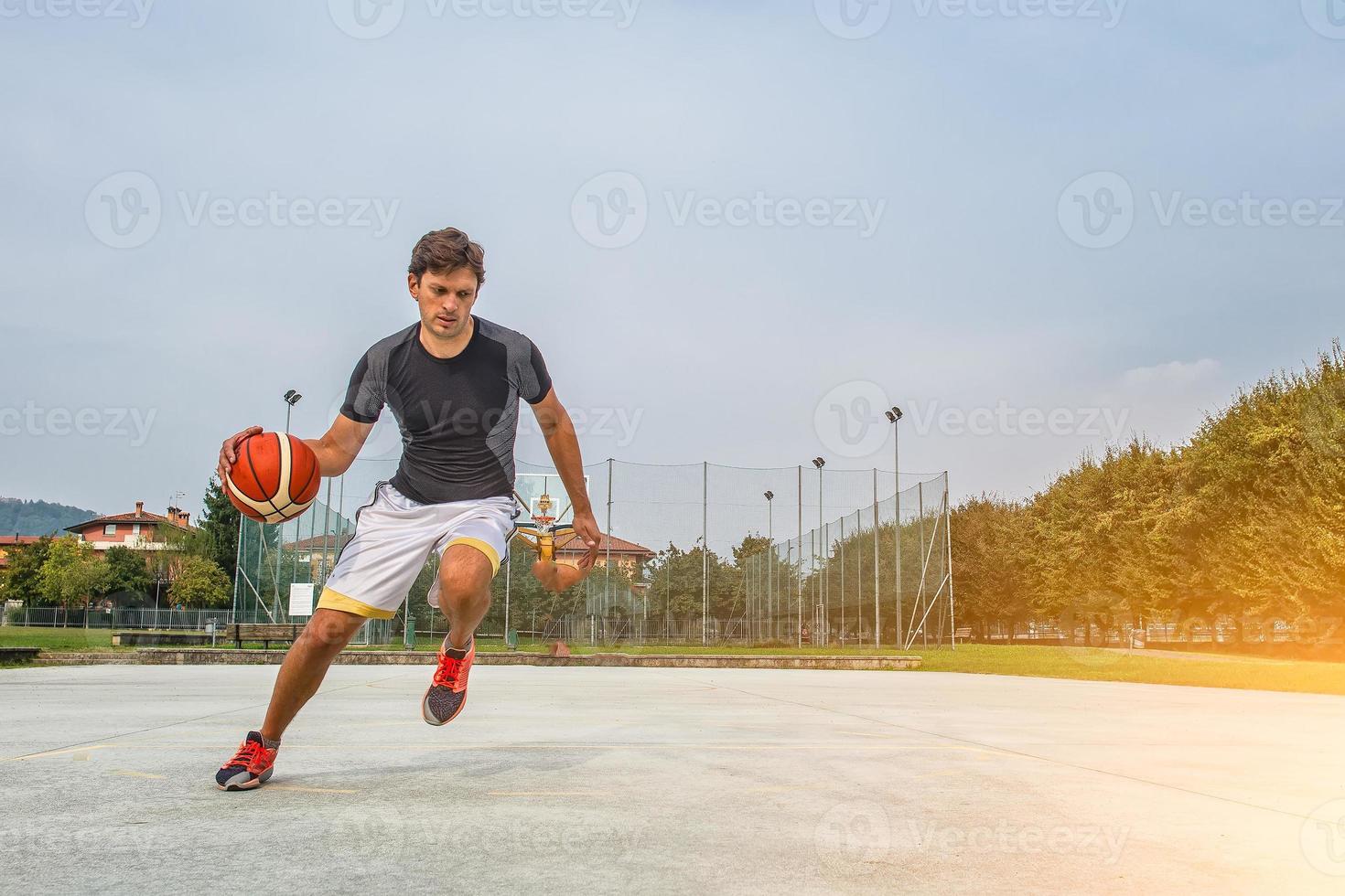 Performance of a white basketball player in the field of road photo