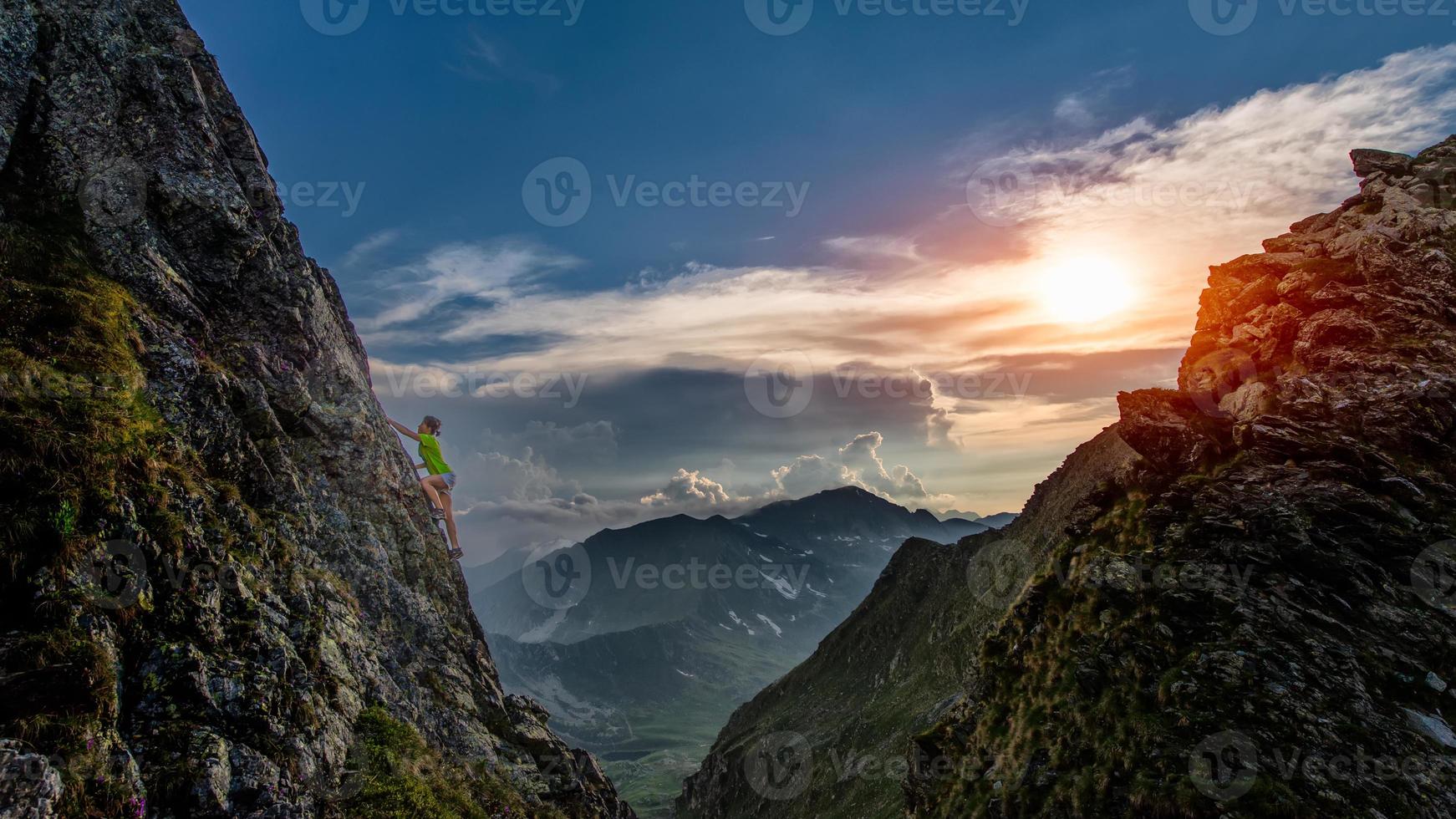 Try climbing at sunset in the mountains photo