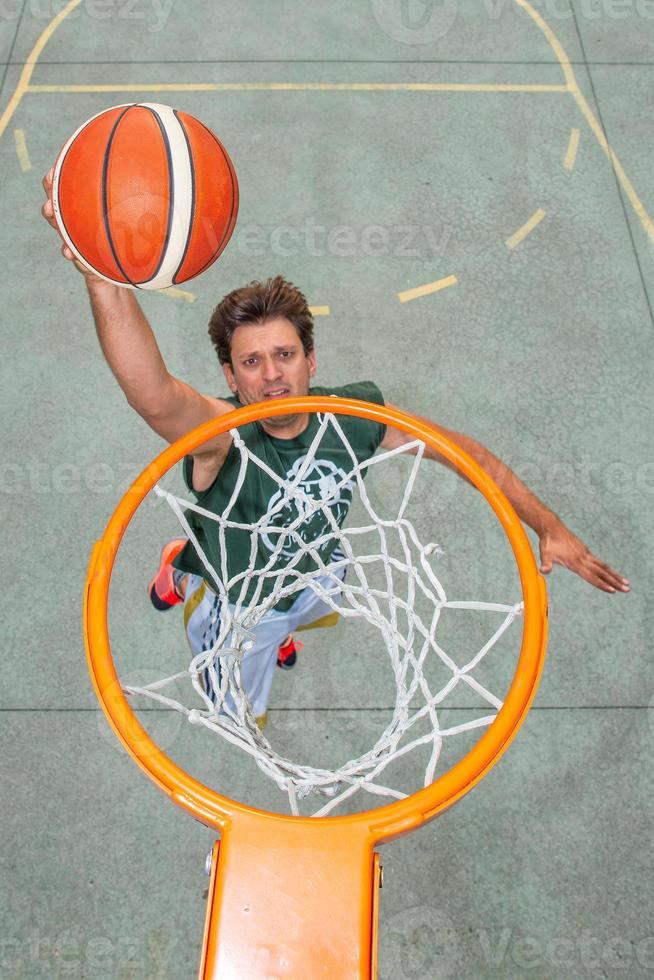 Performance of a white basketball player in the field of road photo