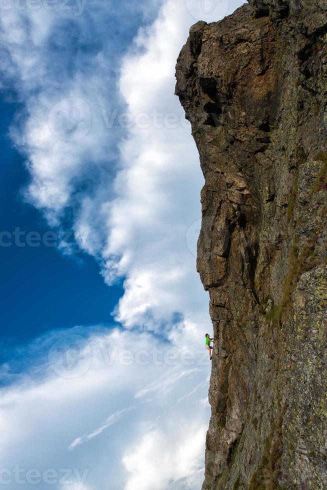 Girl climbing free solo. photo