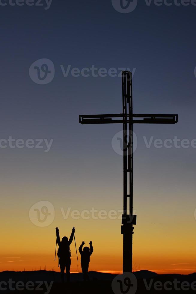Mother with child on top of the mountain near the cross 8702143 Stock Photo  at Vecteezy