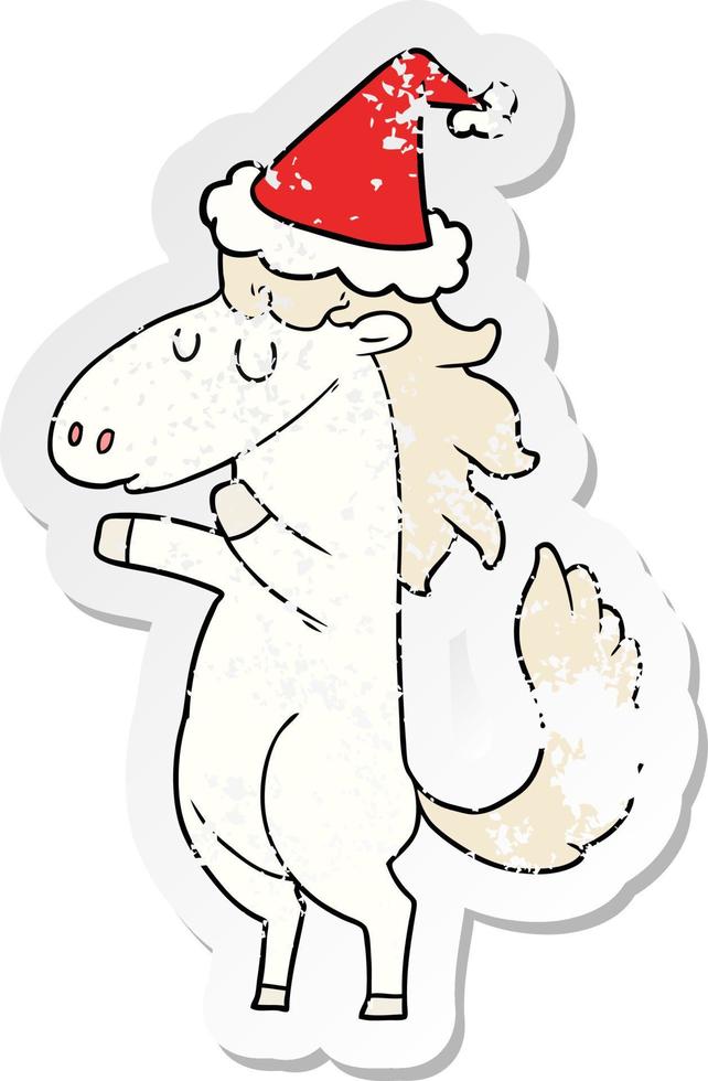 distressed sticker cartoon of a horse wearing santa hat vector