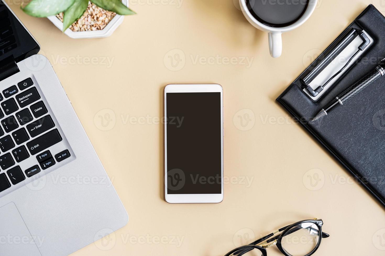 Empty screen Smart phone and file folder on business desk office with copy space, Top view photo