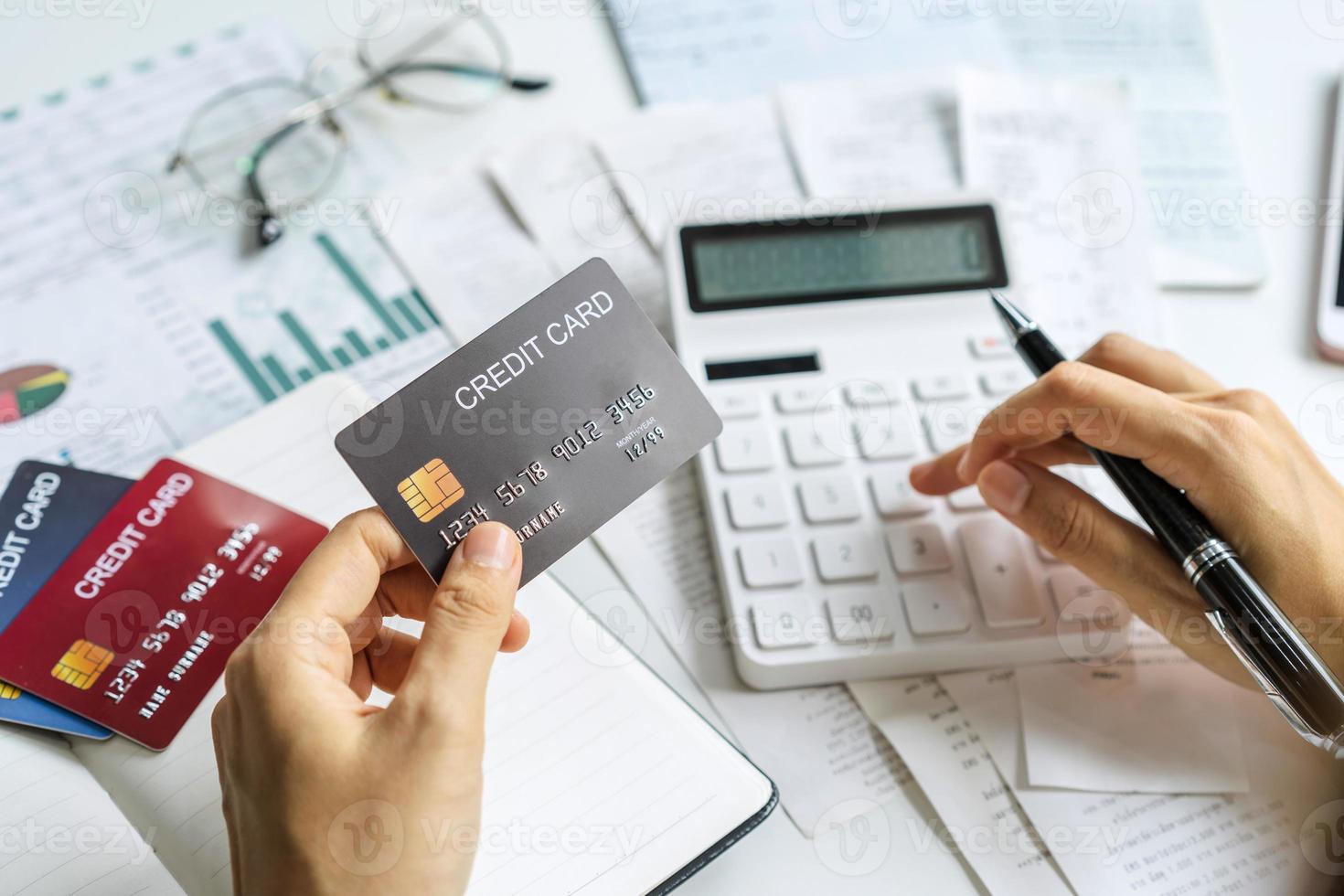 Stressed young woman calculating monthly home expenses, taxes, bank account balance and credit card bills payment, Income is not enough for expenses photo