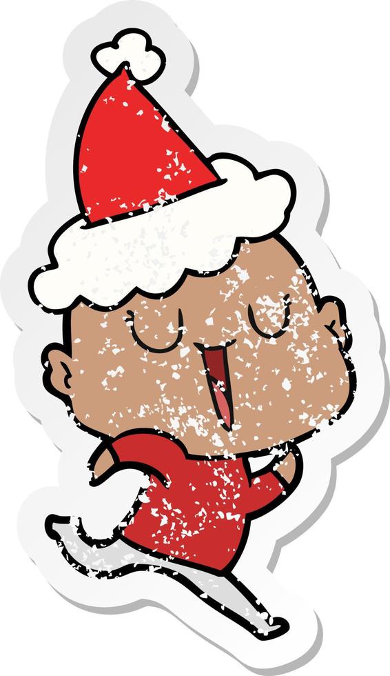 happy distressed sticker cartoon of a bald man wearing santa hat vector