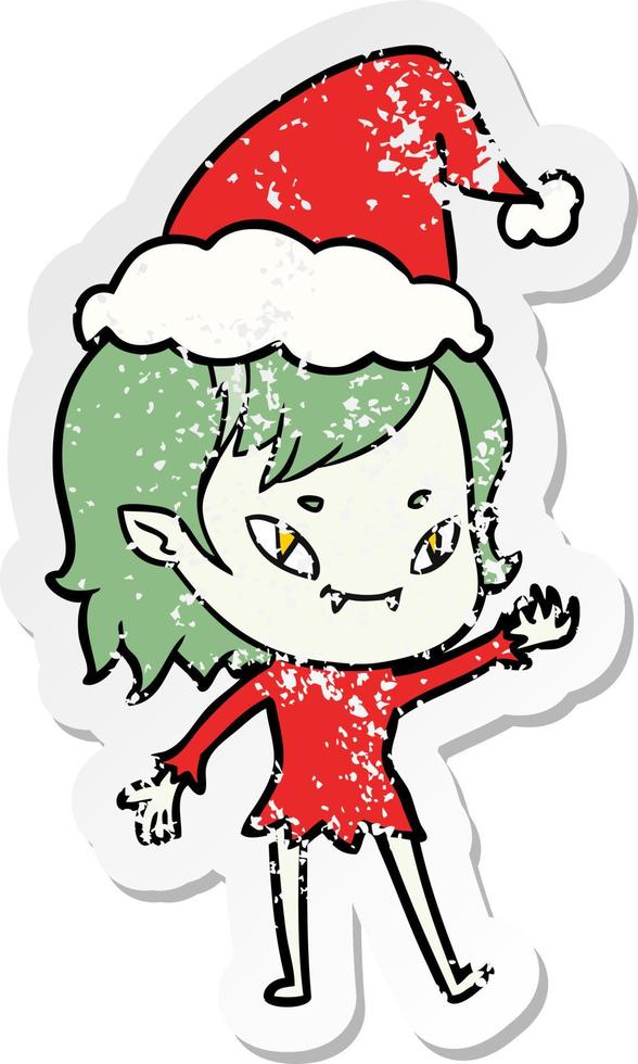 distressed sticker cartoon of a friendly vampire girl wearing santa hat vector