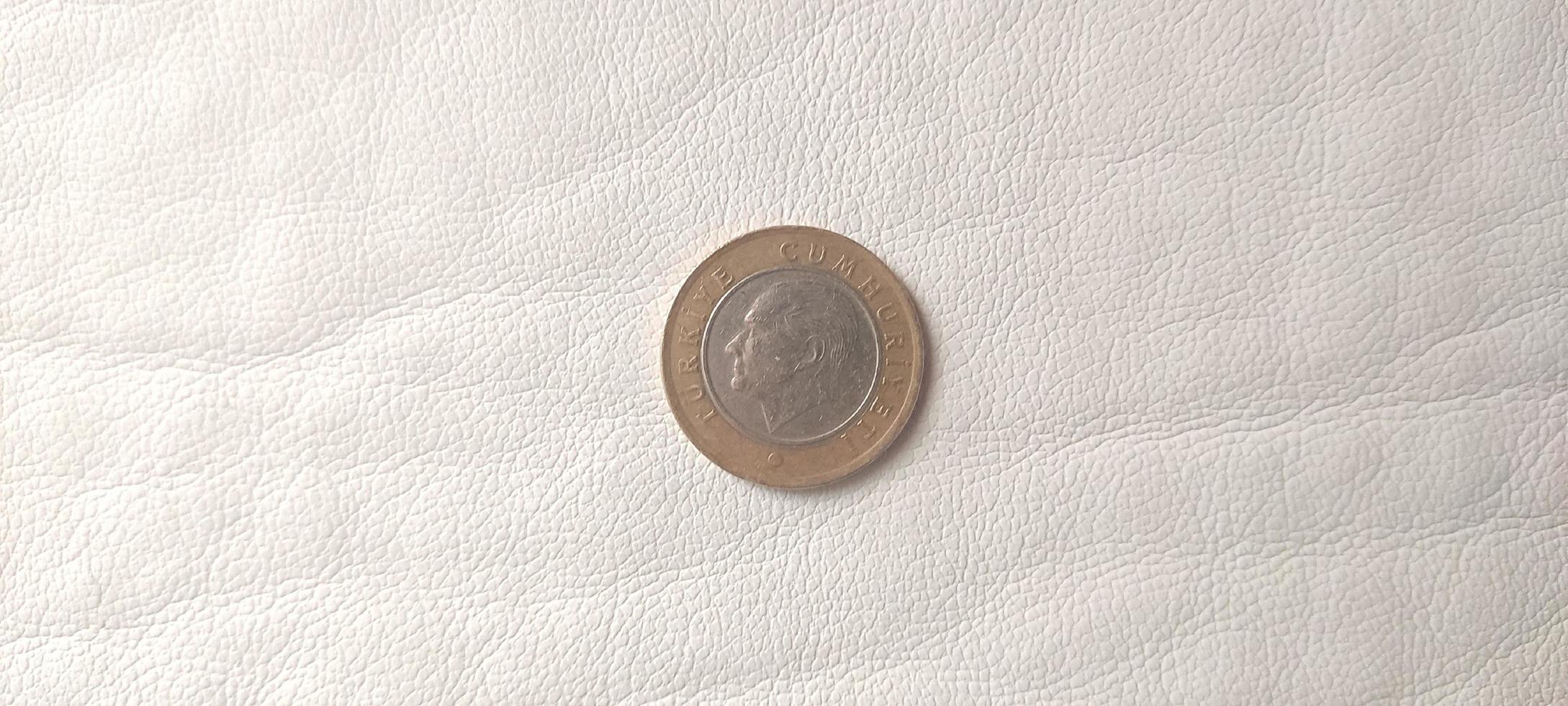 1 Turkish lira on white background photo