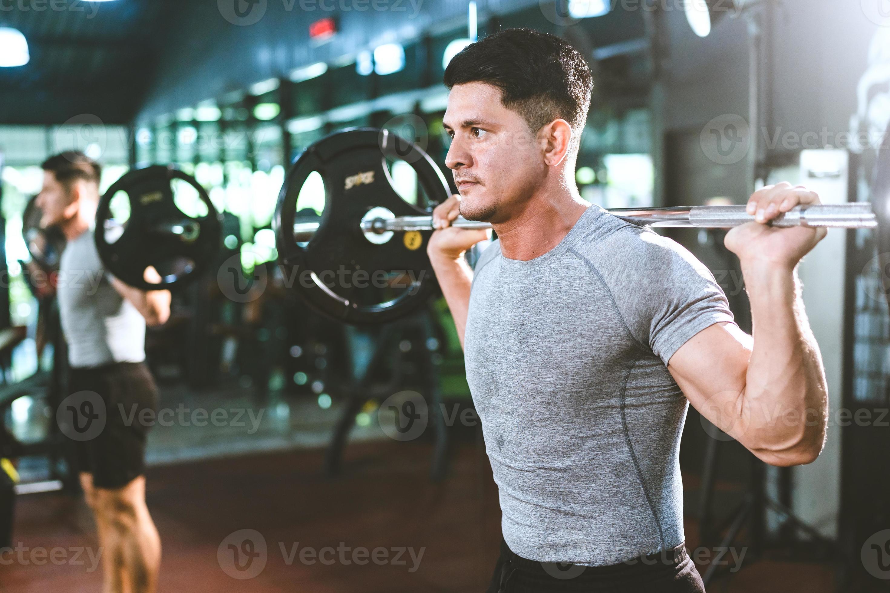 strong athlete man person exercising in the sport gym, workout exercise  training in fitness for body strong and fit, bodybuilding training and  healthy people lifestyle concept 8706785 Stock Photo at Vecteezy