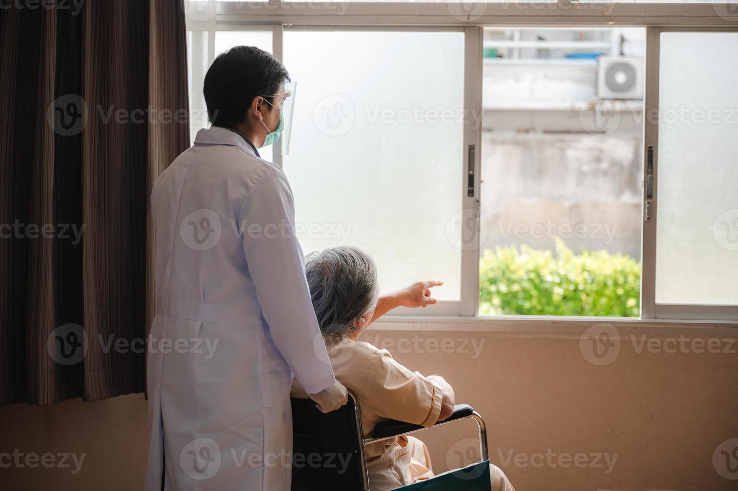 senior elderly patient person visit doctor for health care checkup at hospital, health insurance medical care concept, old man having disease and making medicine help support by nurse at clinic photo